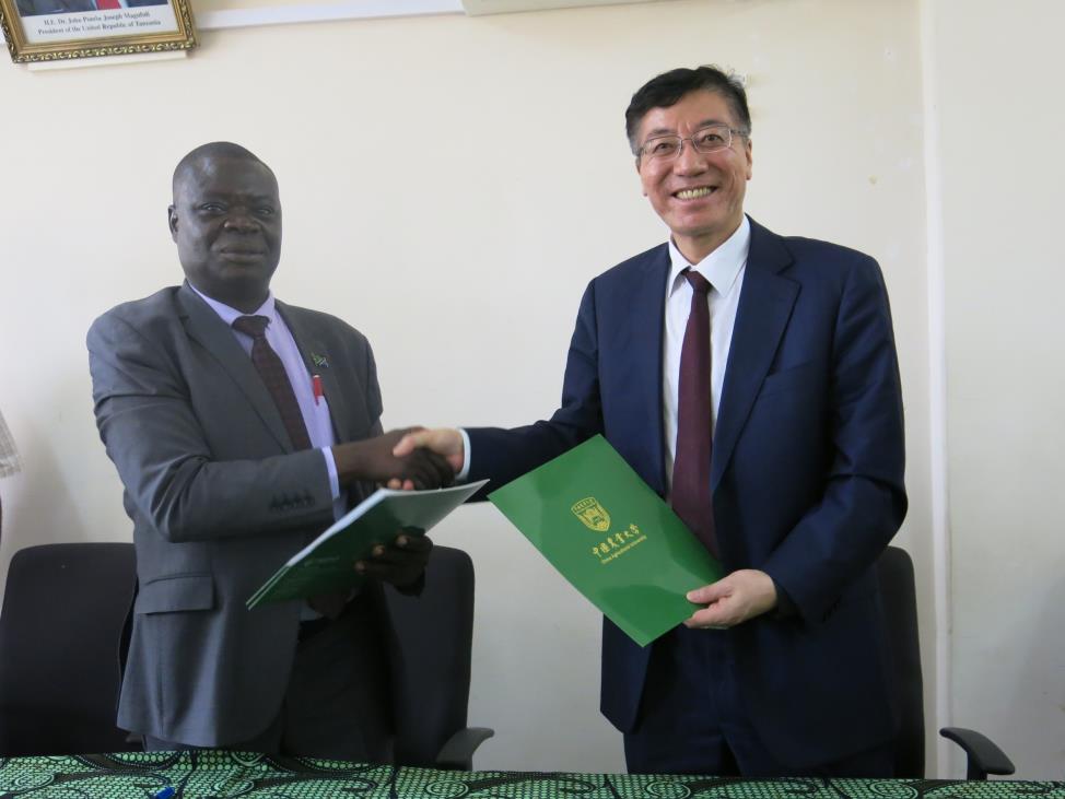 Sokoine University of Agriculture (SUA) Vice Chancellor Prof. Raphael Chibunda (Second left) and the President of China Agricultural University Prof. SUN QIXIN signing partnership agreement between the two universities