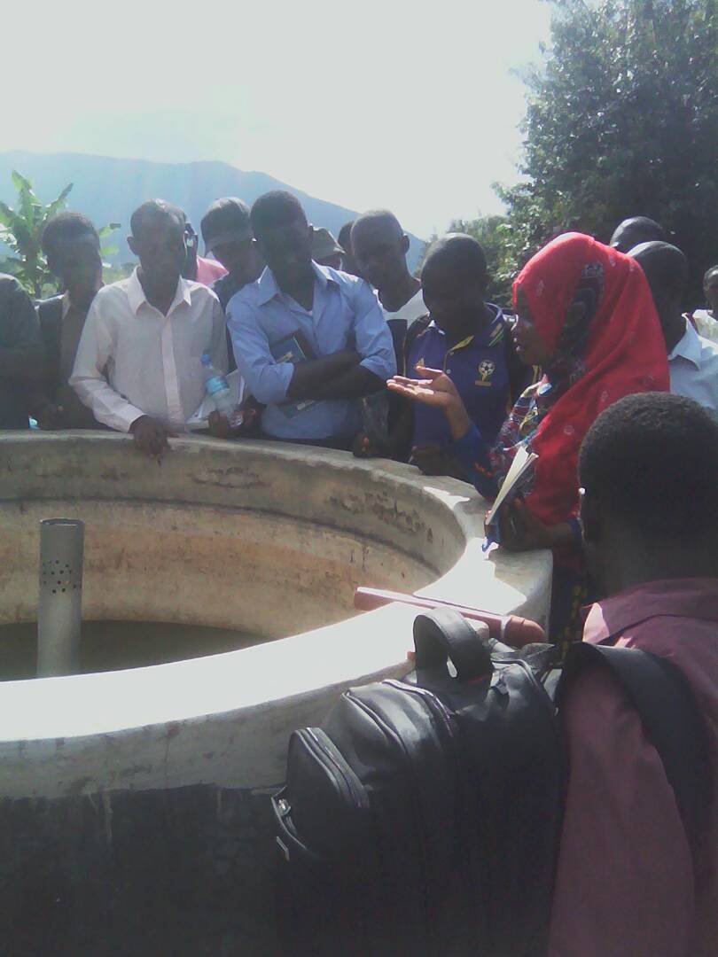 Demonstration of concrete fish pond to participants of fish farming short course 