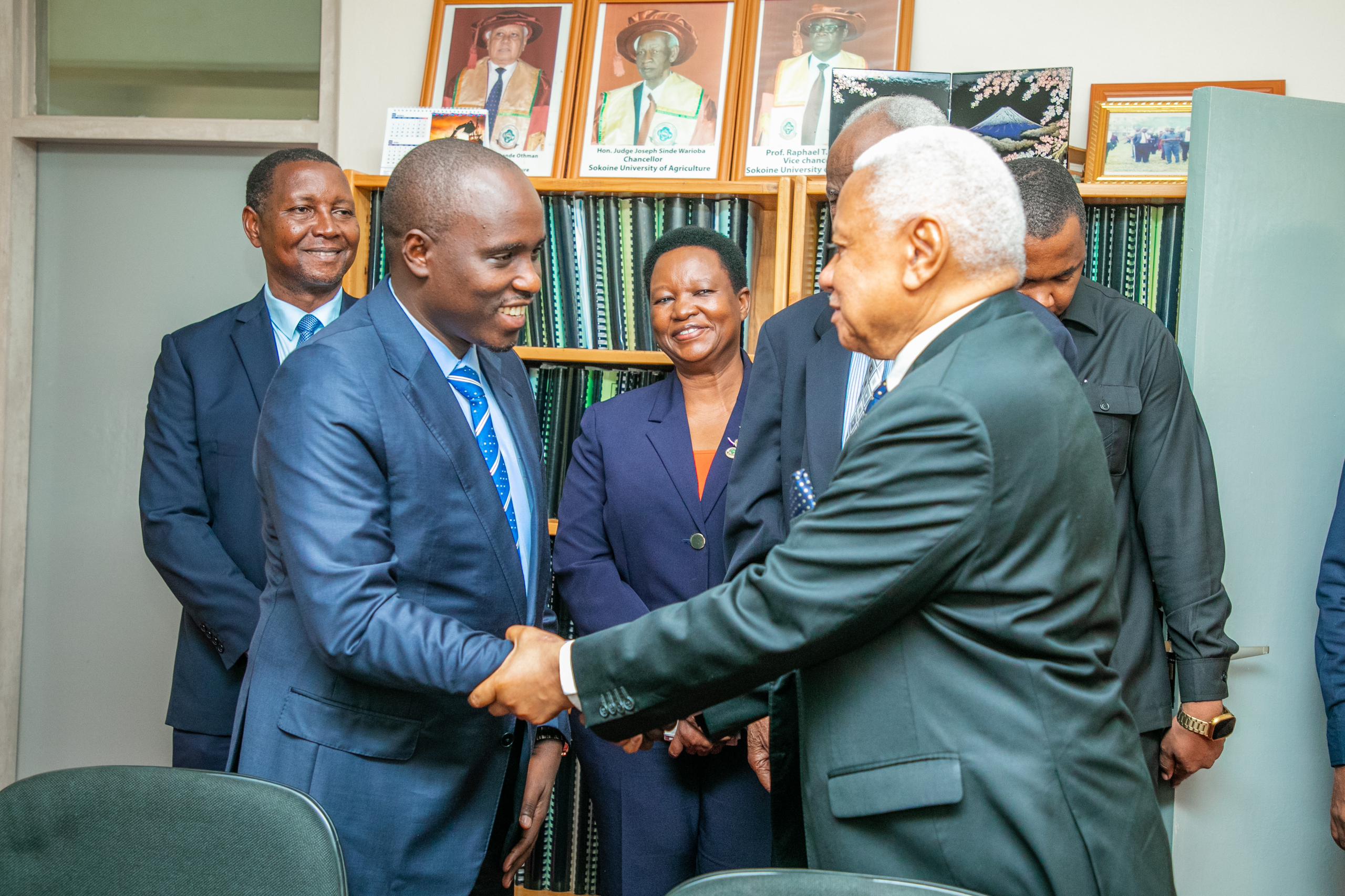 The Deputy Prime Minister and Minister of Energy, Hon. Dr. Doto Biteko exchange views with The Council Chairman, Hon. Judge Mohamed Chande Othman