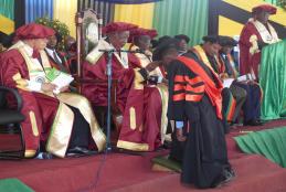 In this picture, Chancellor of Sokoine University of Agriculture (SUA) Hon. Joseph Sinde Warioba (Right) conferring PhD awards to one of graduate during 34th SUA graduation Ceremony which was held on 23rd November 2018 at Nelson Mandela Freedom Square in Solomon Mahlangu Campus located in Mazimbu, Morogoro